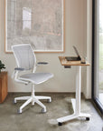 Float Mini Height Adjustable Desk. Bamboo top. White base. Black casters. Compact work surface, petite laptop table. Kansas City Office Furniture.