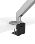 Detail shot of EPPA2 Max Dual Monitor Arm attached to desk. Adjustable monitor support. Kansas City office accessories.