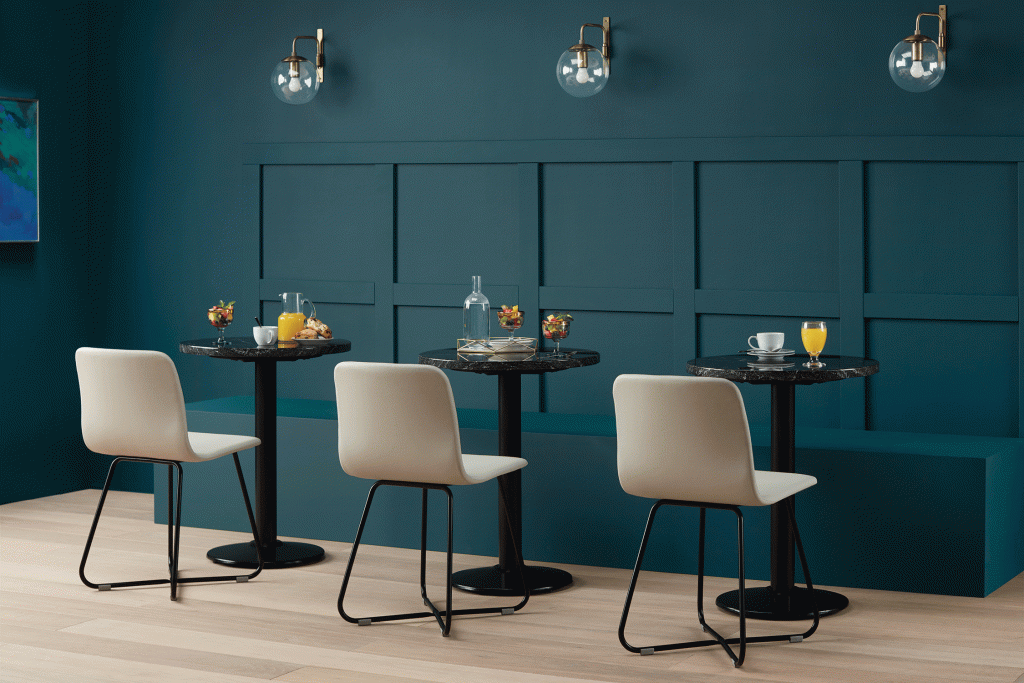 Styled shot of cocktail bar seating featuring Grand Rapids Chair Co. Harper X-Base Side Chairs with upholstered seats and ink black metal frames, Kansas City Office Furniture