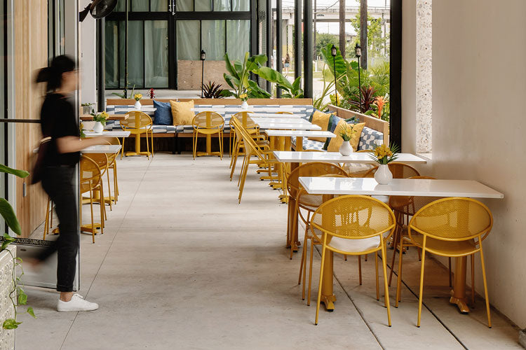 Hula Outdoor Chair with Perforated Steel Seat and Back in honey yellow, outdoor dining area, Kansas City Office Furniture