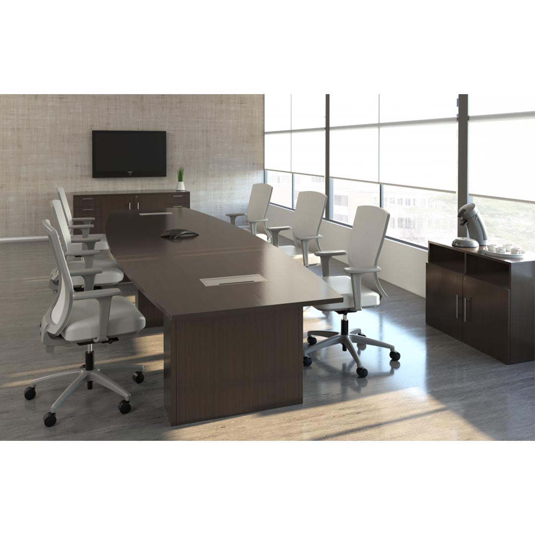 Calibrate Modern Boat-Shaped Conference Table in Corporate Walnut laminate. Two enclosed power grommets. 2MM edge. Kansas City Office Furniture.