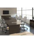 Calibrate Modern Boat-Shaped Conference Table in Corporate Walnut laminate. Two enclosed power grommets. 2MM edge. Kansas City Office Furniture.