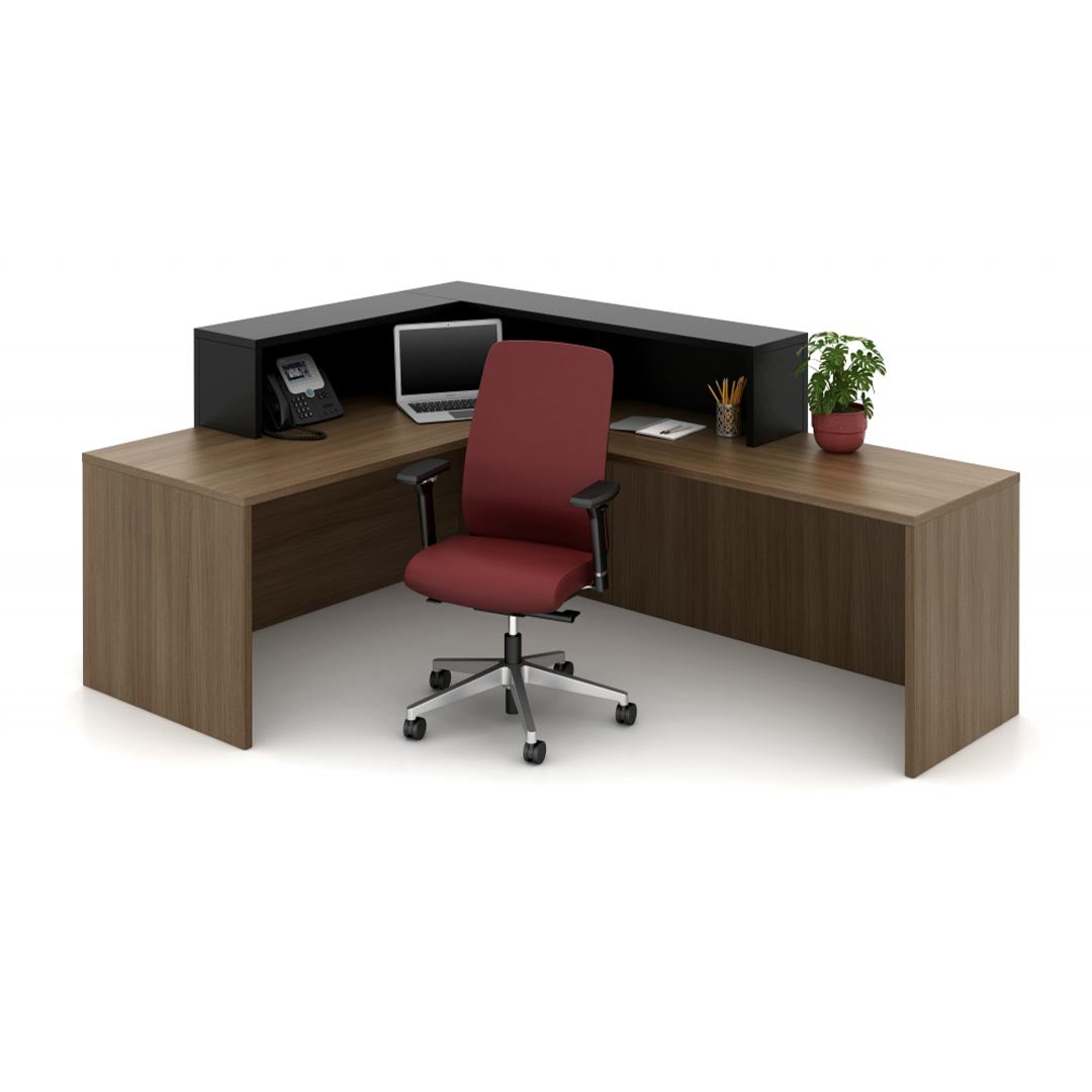 Calibrate Reception area, Corporate Office welcome desk, retail counter station, L desk. Modern walnut and black laminate. Kansas City office furniture.