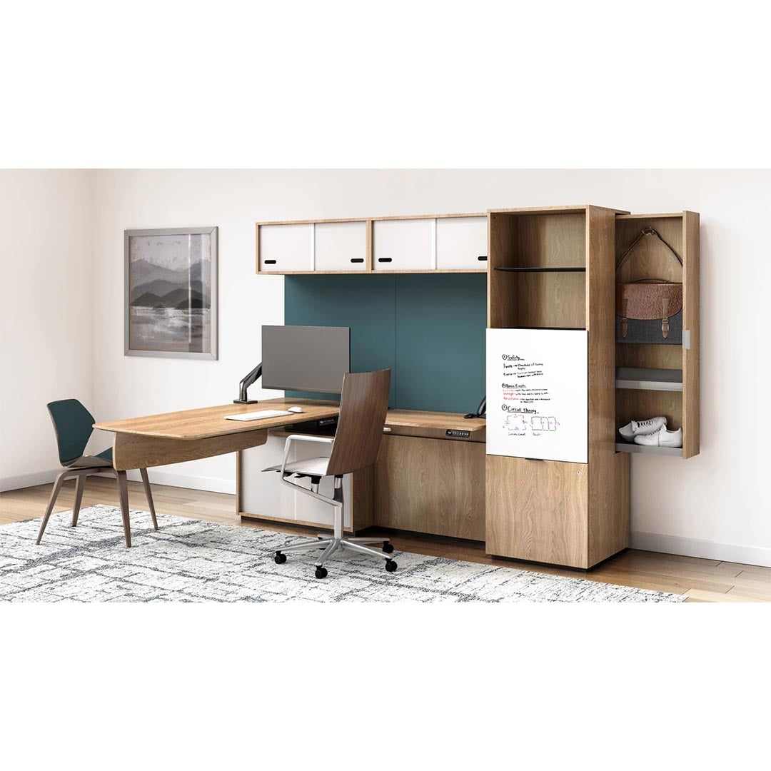 Enwork Cayman corporate office suite, height adjustable workstation, executive desk with cabinets and shelving. Fabric wall. Hidden closet storage. White oak laminate. Kansas City office furniture