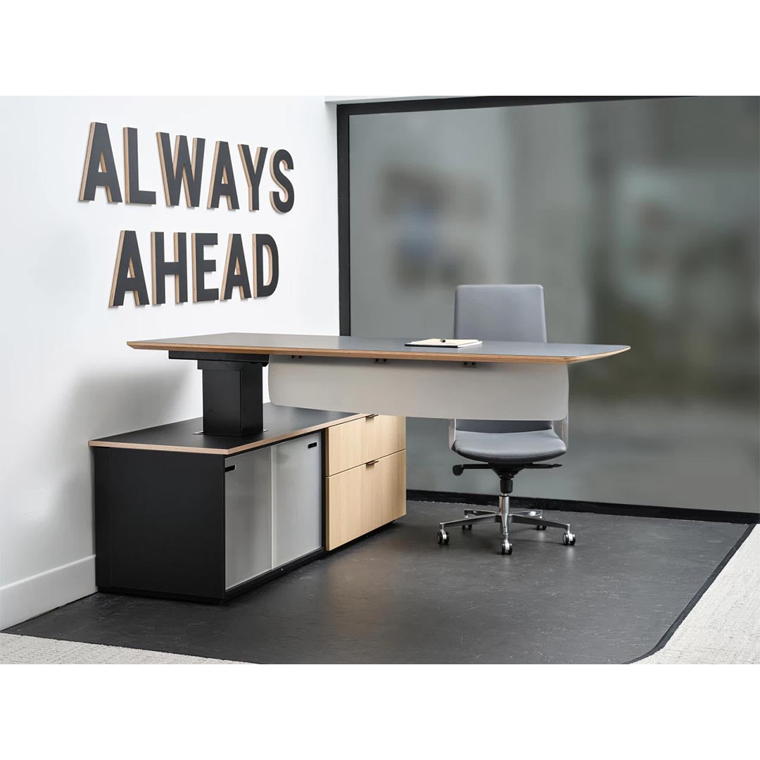 Enwork Cayman corporate office desk. Black and clear ash laminate. Height adjustable workstation positioned at standing height with modesty panel. Executive desk with lower cabinets. Kansas City office furniture