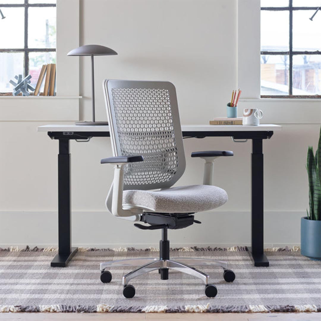 OFS Genus Office Desk Chair with Elastomer Back in cozy office with natural light, chalk frame with polished aluminum base, Kansas City Office Furniture