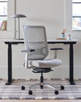 OFS Genus Office Desk Chair with Elastomer Back in cozy office with natural light, chalk frame with polished aluminum base, Kansas City Office Furniture