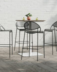 Grand Rapids Chair Co. Hula Outdoor Barstools in ink black around Bowen outdoor pedestal table, Kansas City Office Furniture