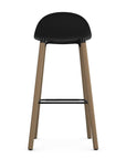 Back view of Allermuir Kin Low-Back Barstool with black seat and Clear Ash Wood Legs, Kansas City office furniture