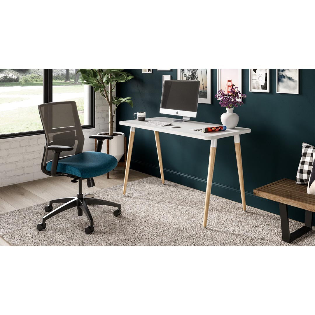 Reya Office Desk with Tapered Bamboo Legs in modern home office with natural light. Kansas City office furniture.